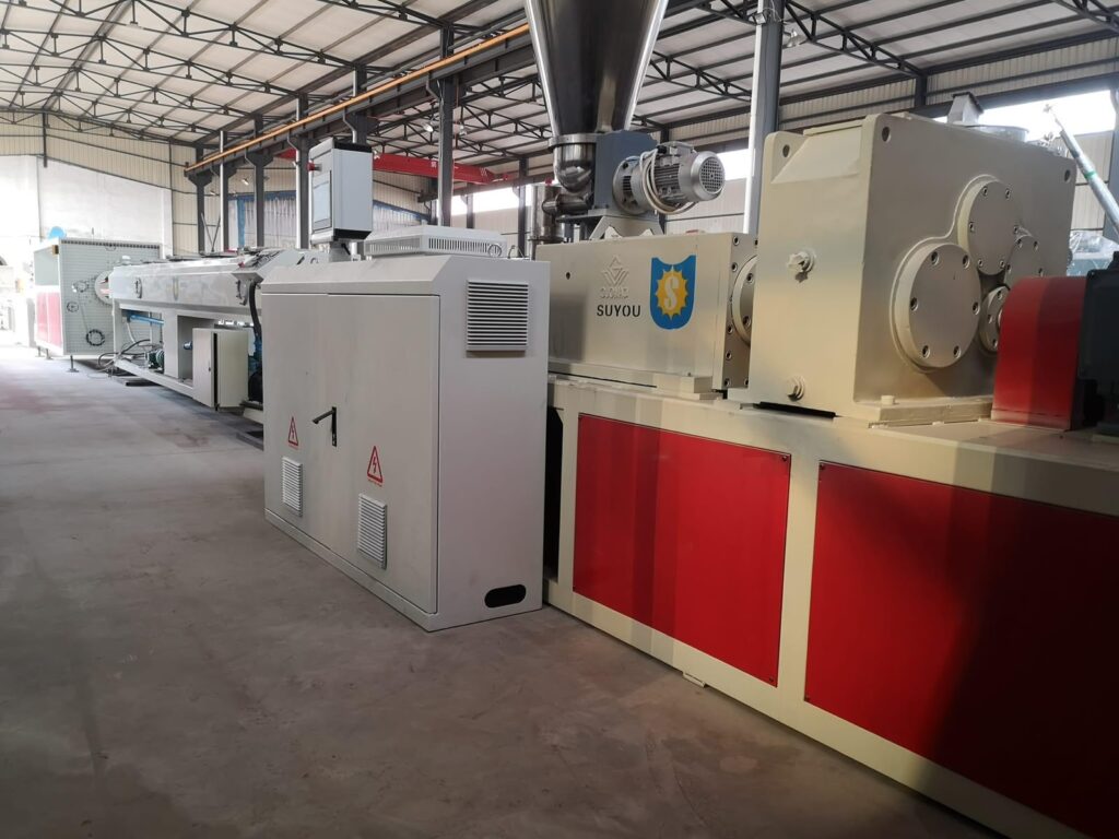 Extruder and downstream line producing UPVC pipe at Aqtar Najd