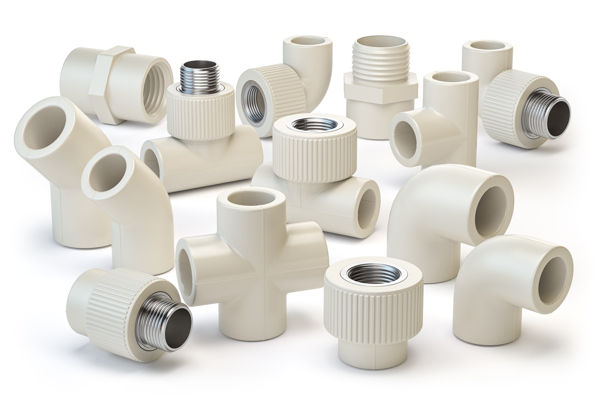 Assorted CPVC pipe fittings with threaded metal inserts, arranged on a white background